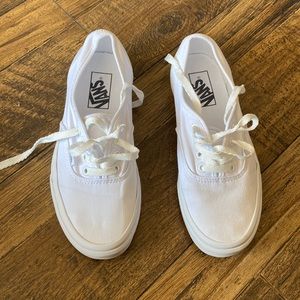 All white Authentic Vans